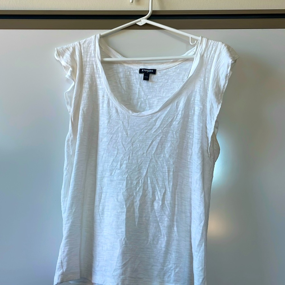 Super feminine white shirt with cute ruffles at the top of arms